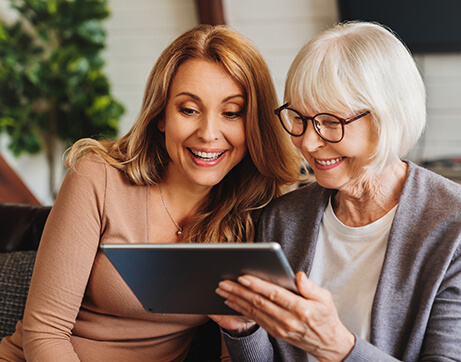 women looking at tablet starpoint personalized home care